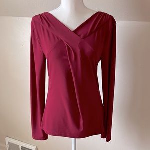 Ann Taylor long sleeve cross front V neck blouse.  Burgundy, wine color